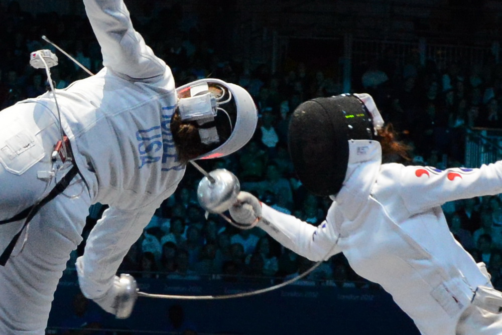 Courtney Hurley fights for Team USA in their semi-final match against Korea