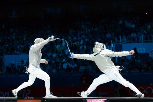 Ochiuzzi (ITA, left) in action at the 2012 Olympics - Men's Sabre. Photo C. Harkins / Fencing.Net