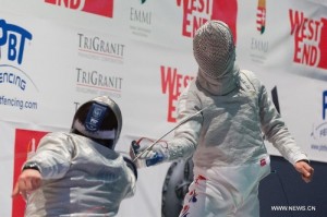 Aron Szilagyi (left) faces Junghwan Kim (right) (photo: http://www.globaltimes.cn/content/847306.shtml)